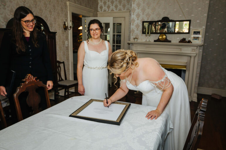LGBTQ Brides Signing Ketubah